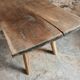 Antique work table / primitive dining table in oak, Hungary, circa 1900–1930.