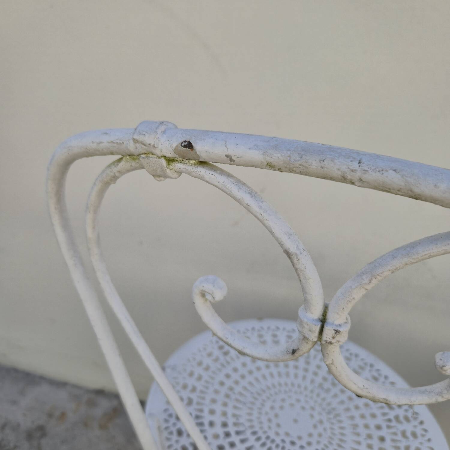 Pair of wrought iron garden chairs, antique manufacture