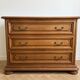 Antique wooden chest of drawers with three drawers.