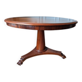 Round mahogany table with extensions