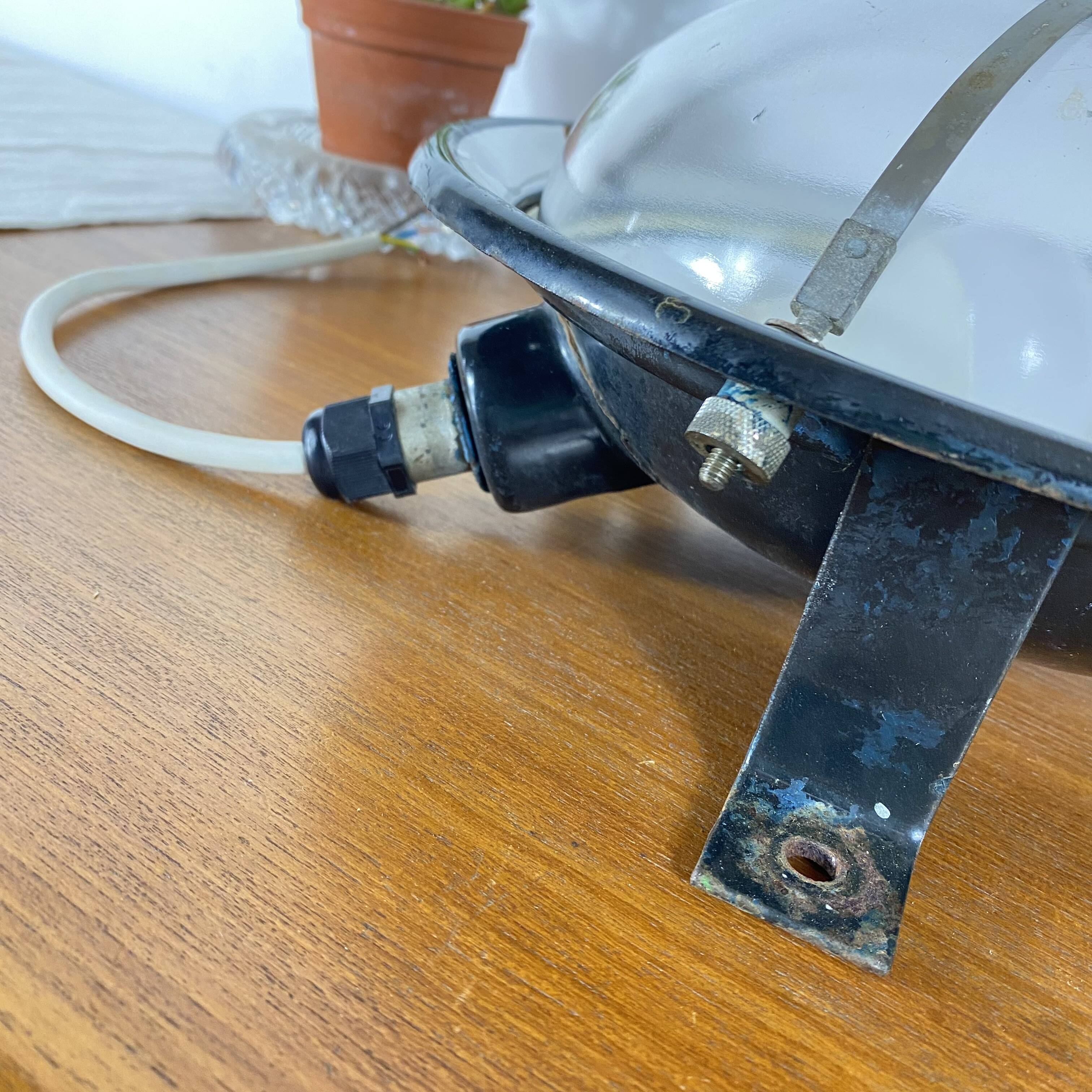 Pair of vintage industrial wall sconces or ceiling lights in enamelled sheet metal.