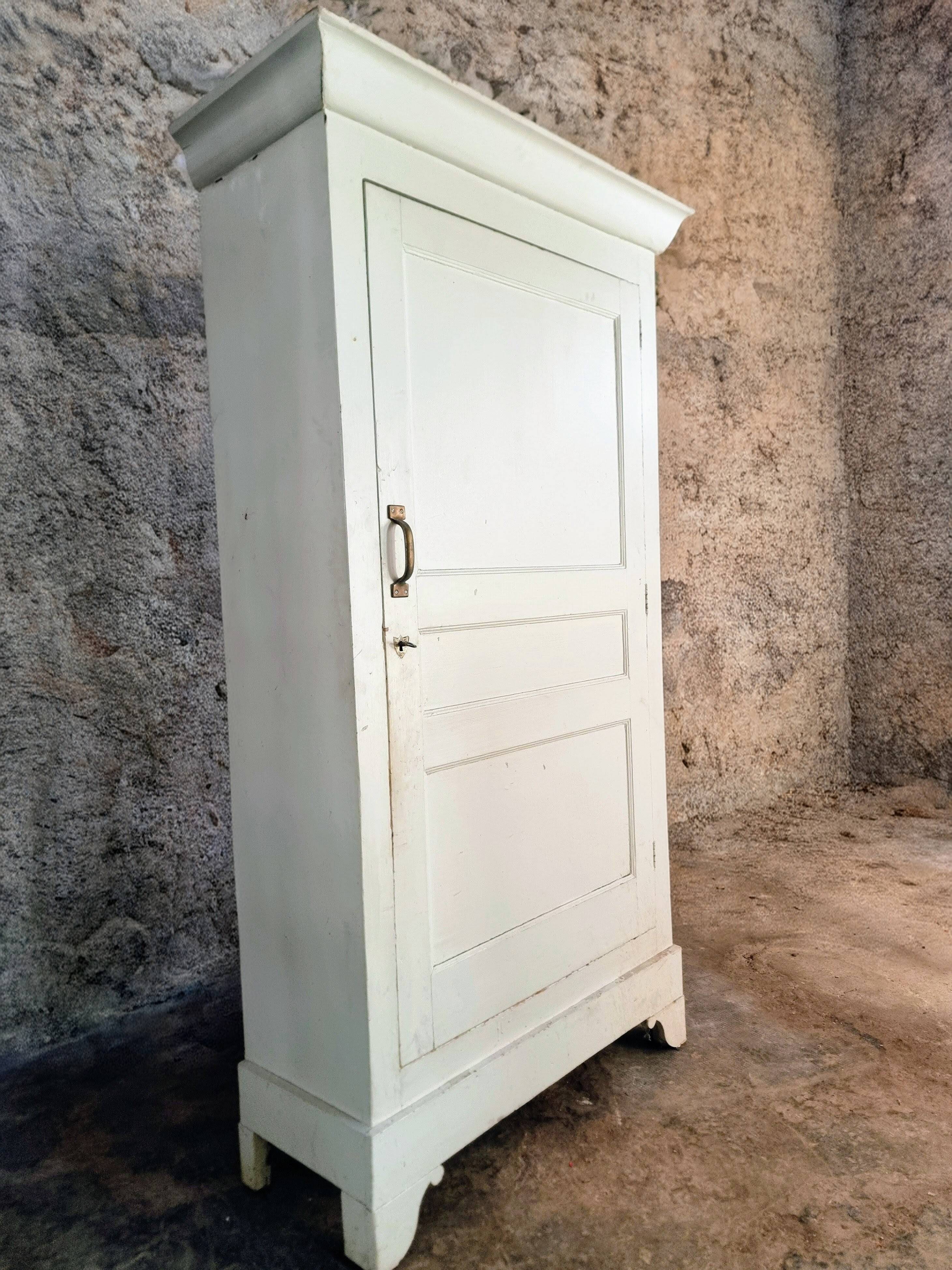 Antique French pine wardrobe with original white paint, circa 1900–1920.