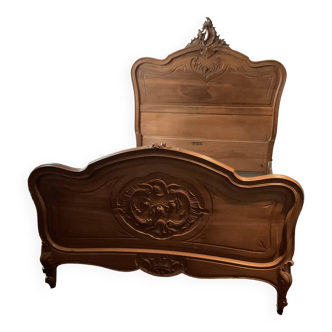Louis XV style bed in carved walnut