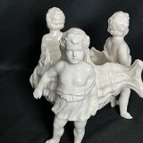 Porcelain, centerpiece with candle holder decorated with putti, 20th century