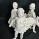 Porcelain, centerpiece with candle holder decorated with putti, 20th century
