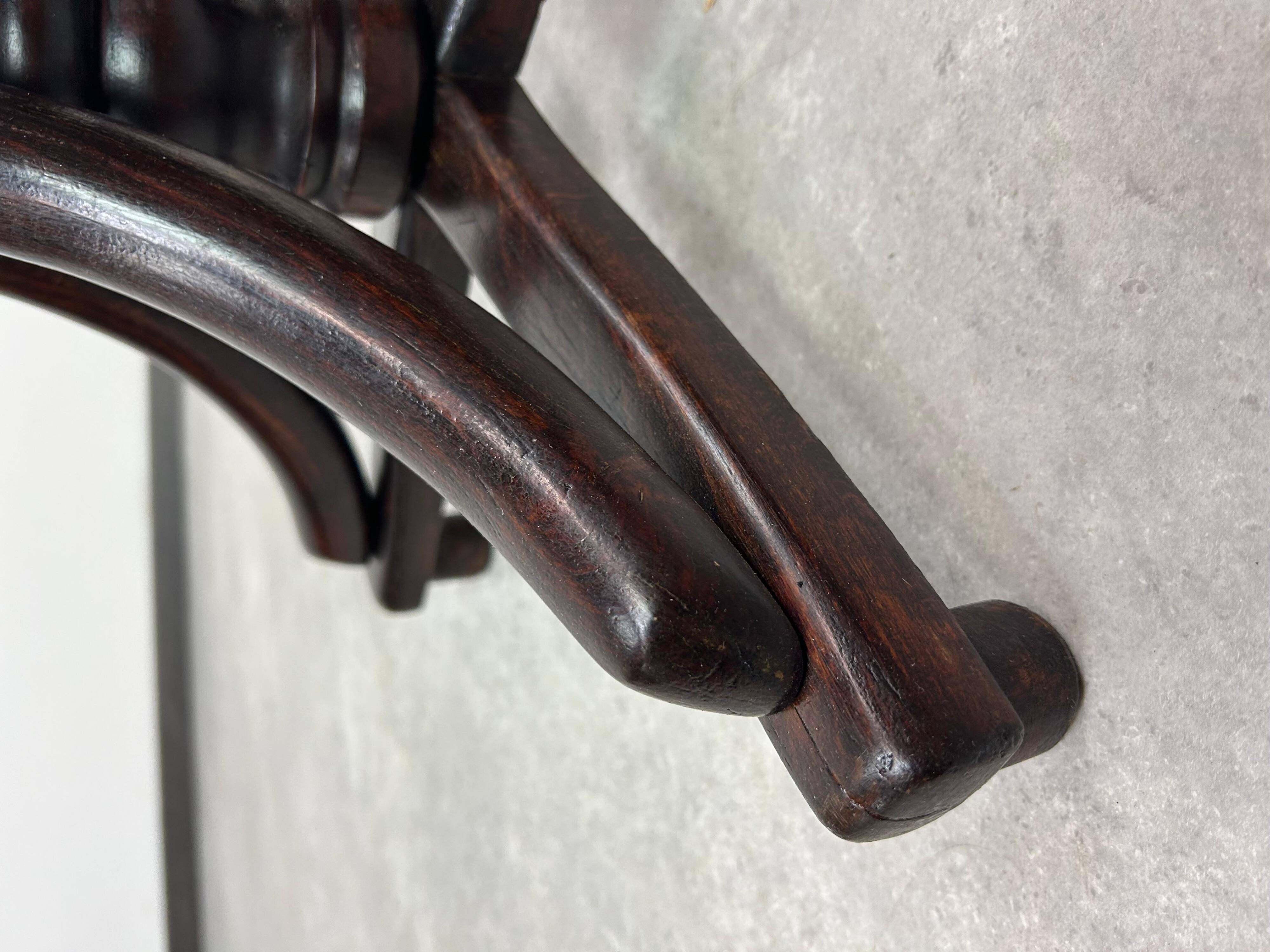 Curved wooden piano chair by Thonet