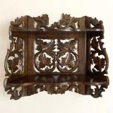 Carved wooden wall shelf