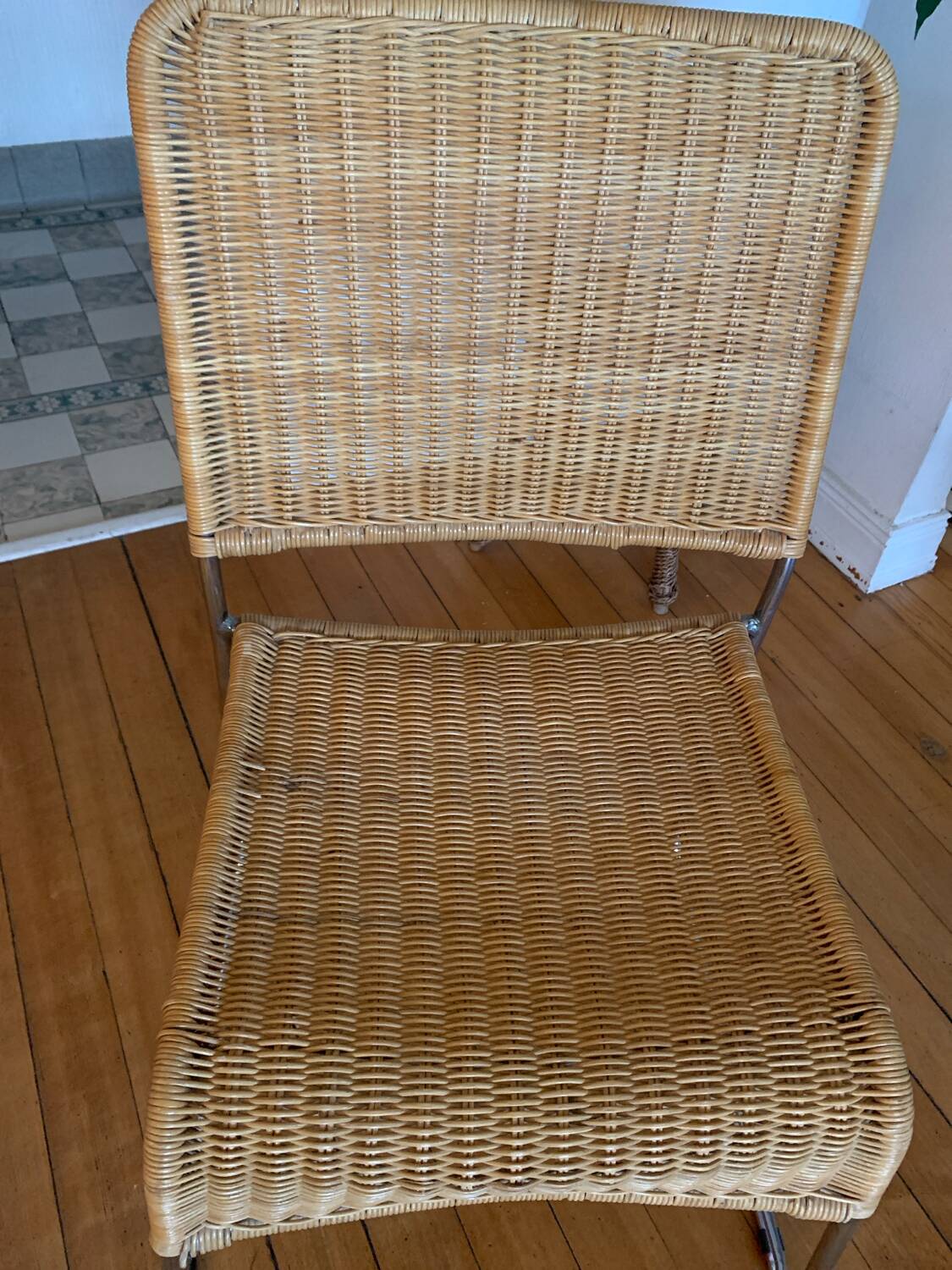 Vintage wicker and chrome chair from the 1970s.