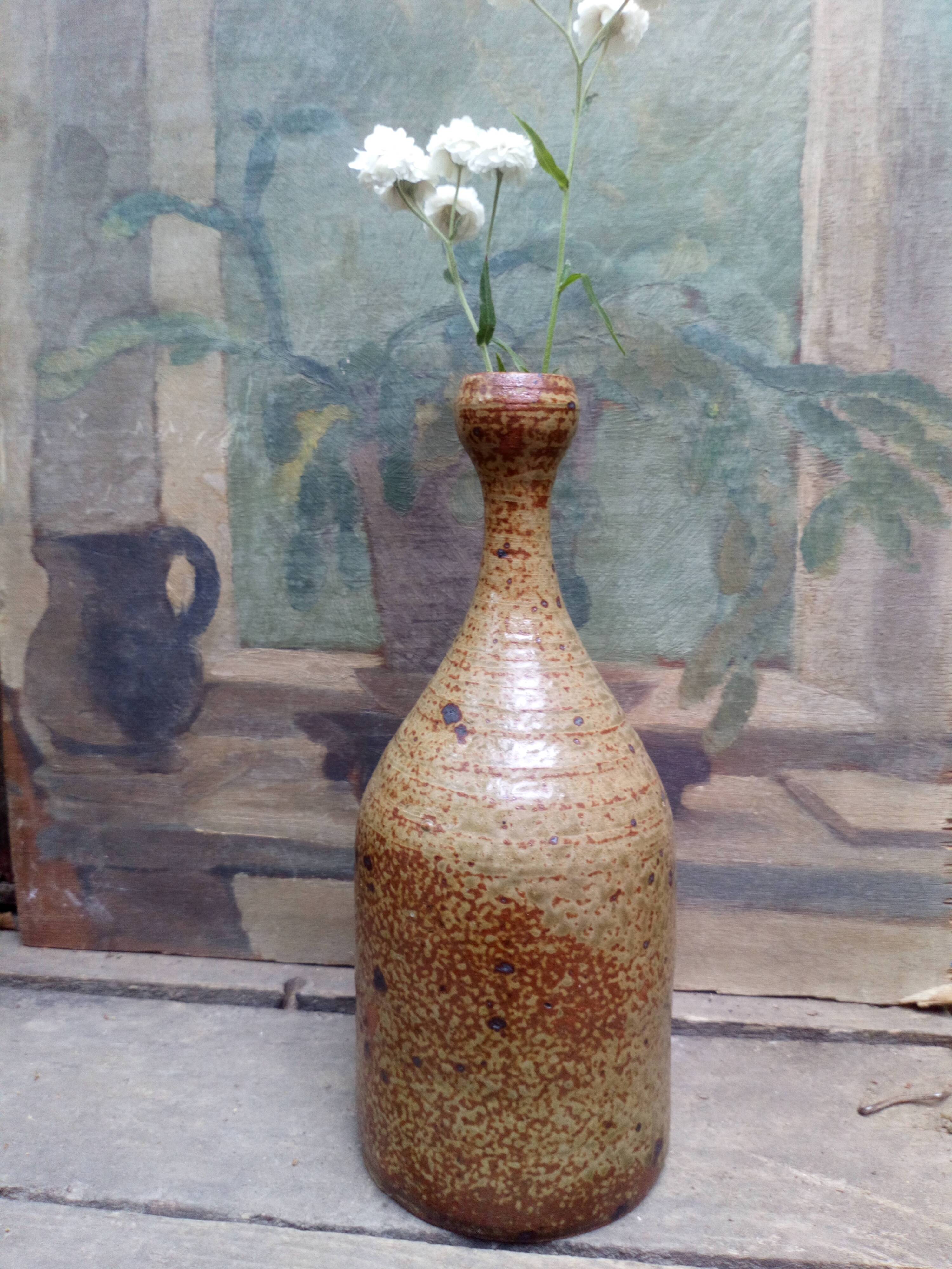 Bottled sandstone vase with a narrow neck