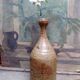 Bottled sandstone vase with a narrow neck