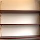 Scandinavian wall-mounted bookcase with floating rosewood shelves, period