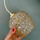 Suspension globe vintage en verre moulé ambré