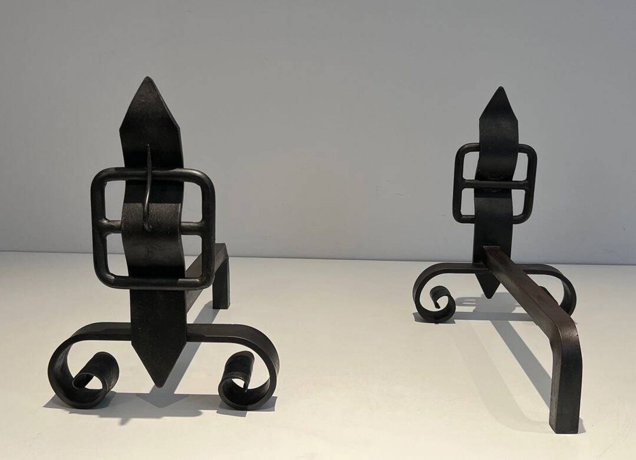 Pair of Wrought Iron Andirons with Obelisk and Belt Motifs