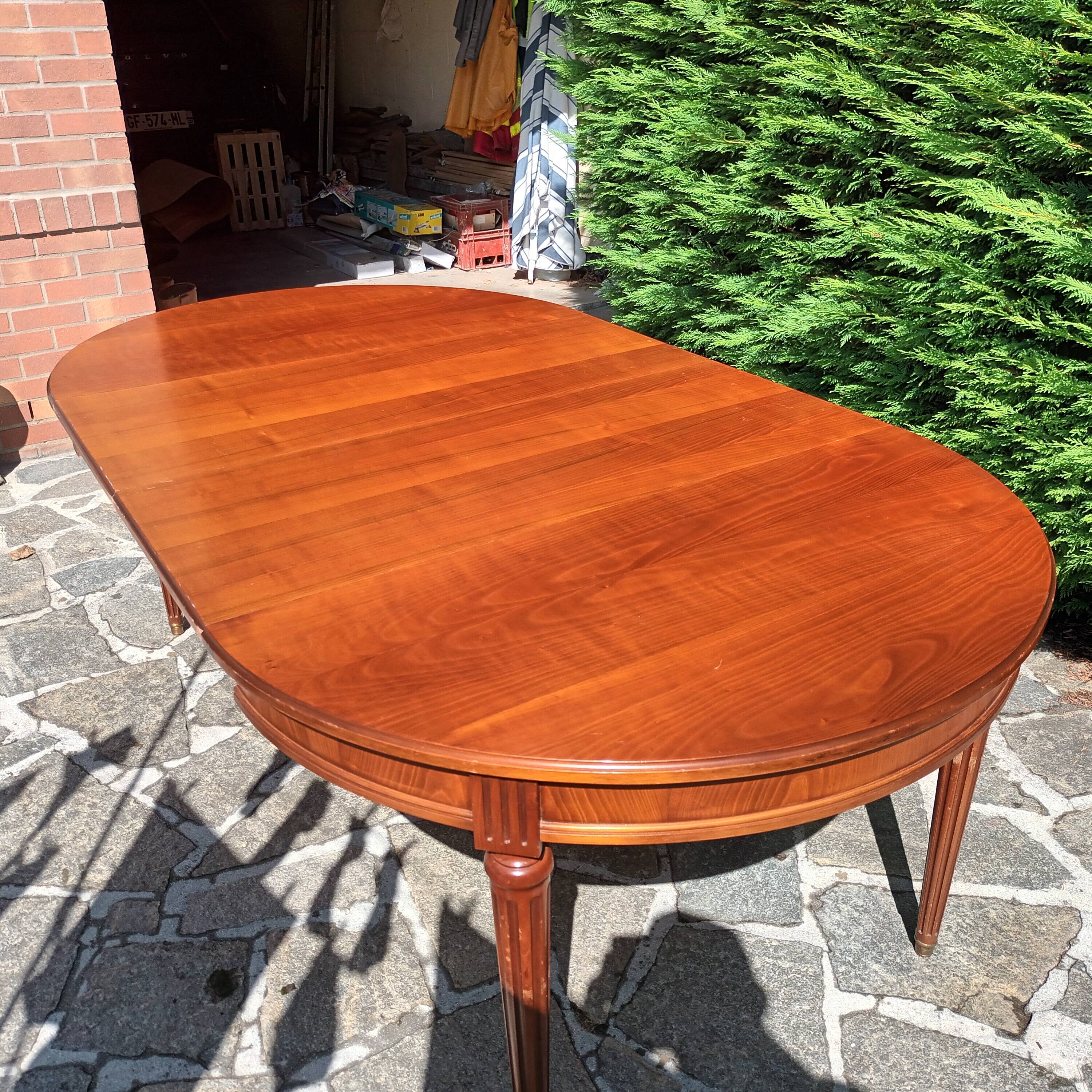 Cherry wood Louis XVI table with 2 extensions.