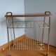 Table trolley for vinyls or magazines in gold metal and formica