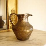Old solid metal pitcher