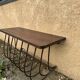 Old iron and wood console measures approximately: height 45 cm length 80 cm, depth 30.5 cm