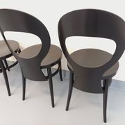 Set of 4 vintage Mouette chairs by Baumann in black wood from the 1960s.