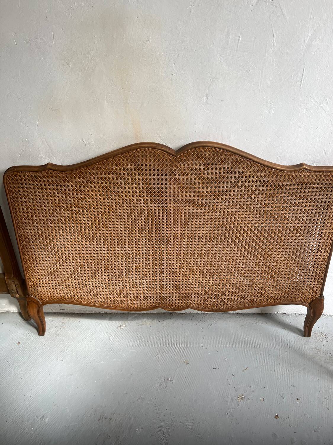 Old wooden and cane bed