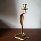 Candlestick mounted on brass cobra