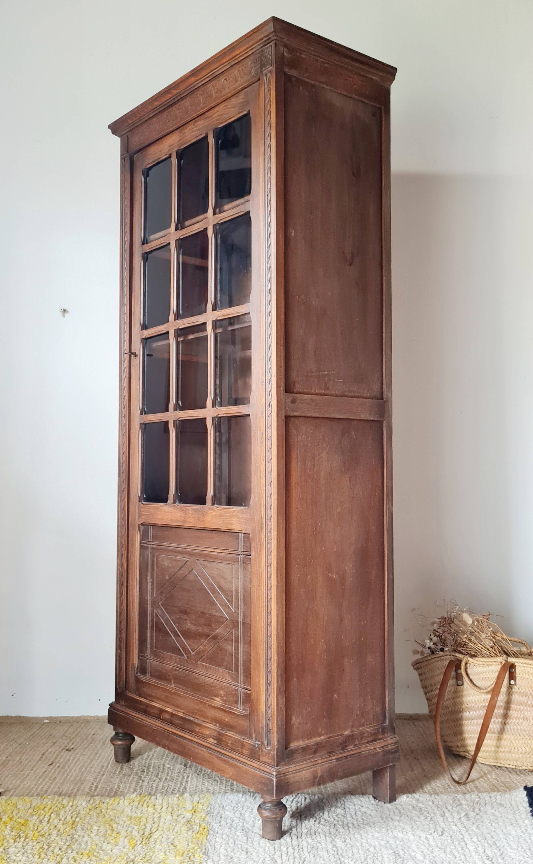 Old glass-fronted library in solid wood
