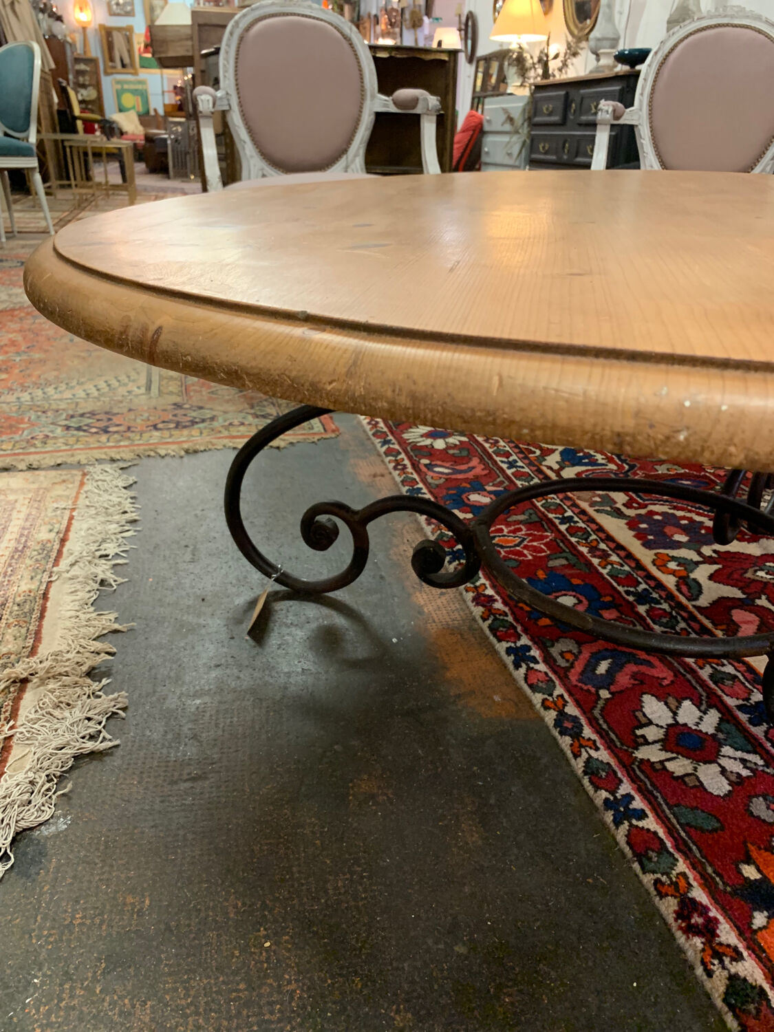 Round wood and wrought iron coffee table
