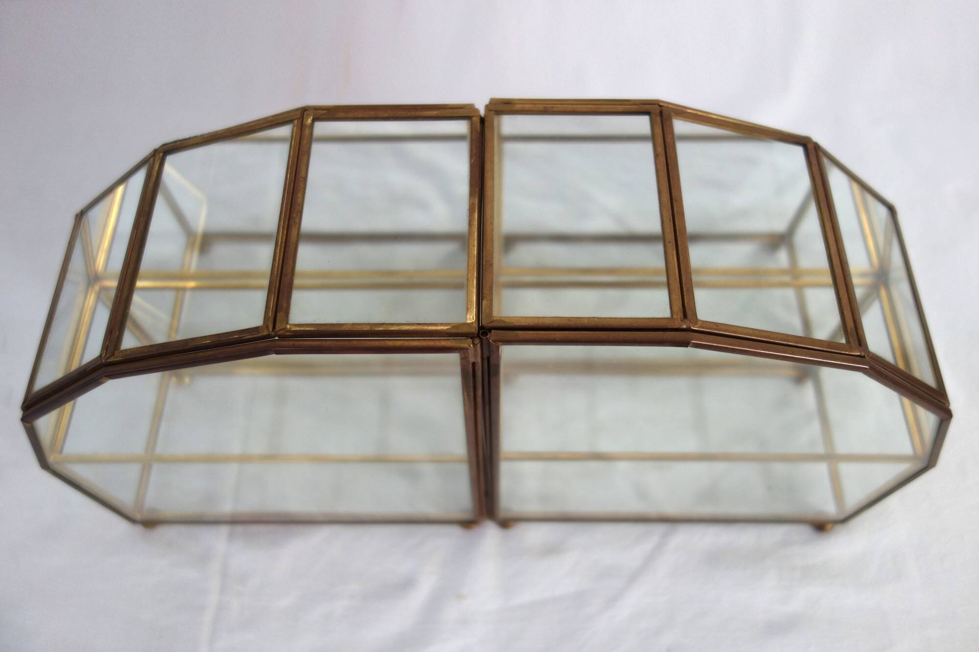 Pair of gilded brass, glass, mirror display cases from the 60s