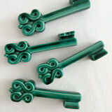 4 green ceramic knife rests in vintage key shape