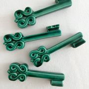 4 green ceramic knife rests in vintage key shape