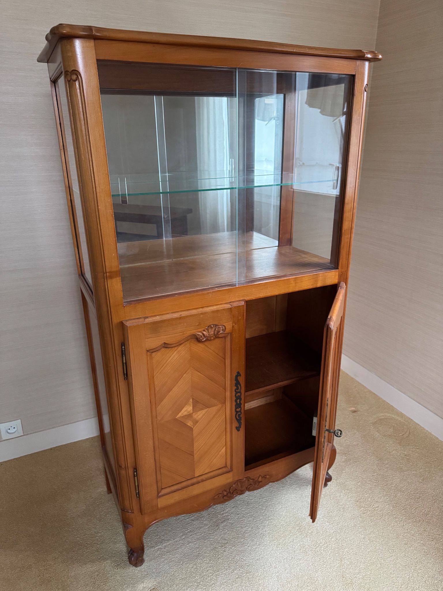 Louis XV style display cabinet, glass doors and chevron panels.