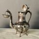 Coffee or tea service monogrammed cr silver metal