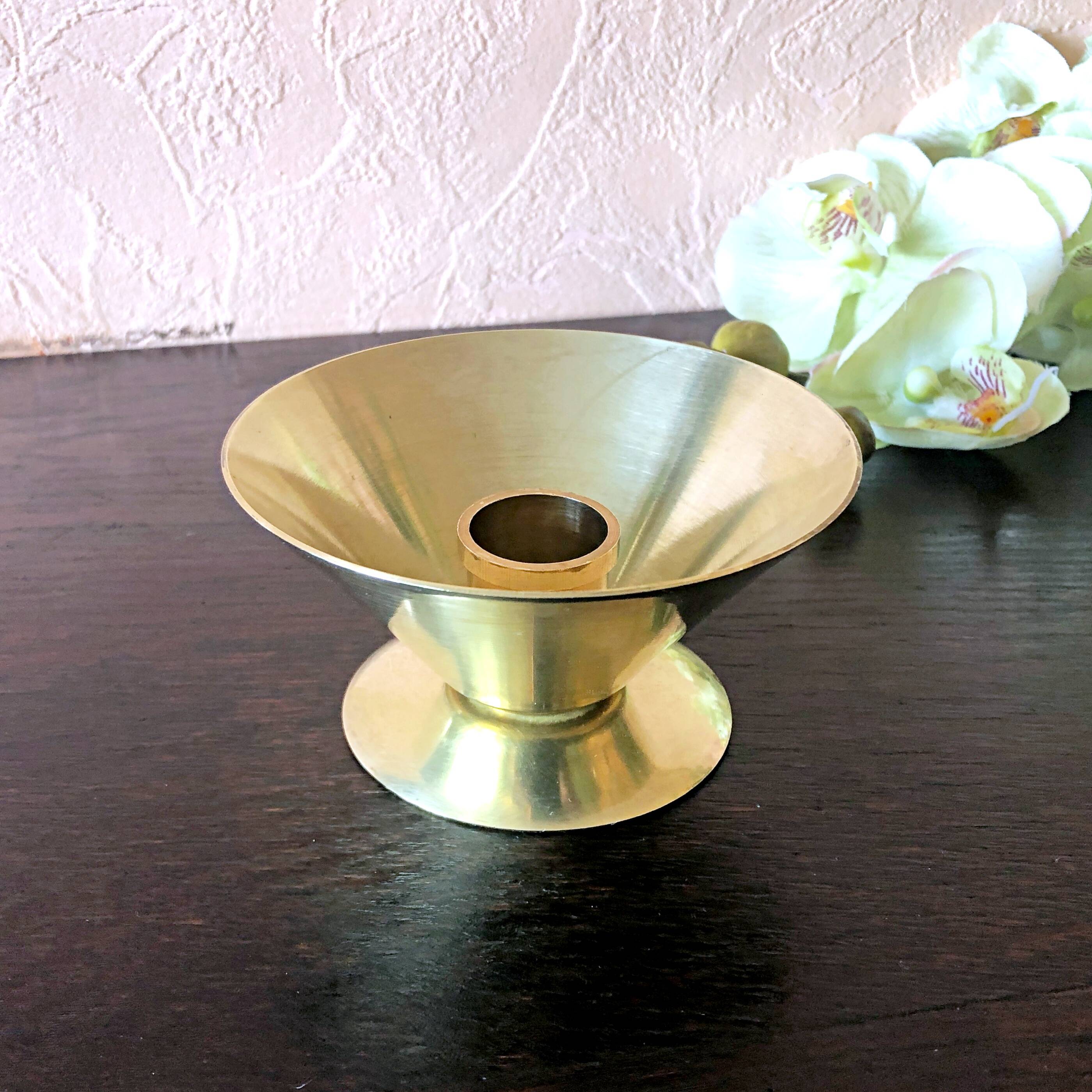 Table candle holder in golden brass