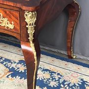 Louis XV style desk. Rosewood veneer, gilt bronze decoration, leather.