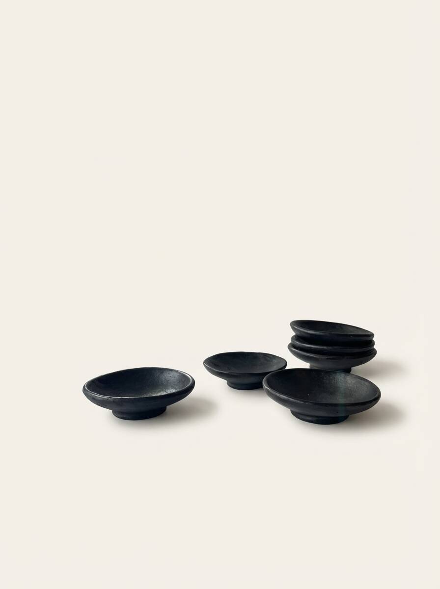 Two smoked terracotta bowls—for mezze, spices, or Kanah sauces.