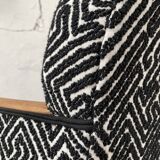 Club armchair in wood and fabric.