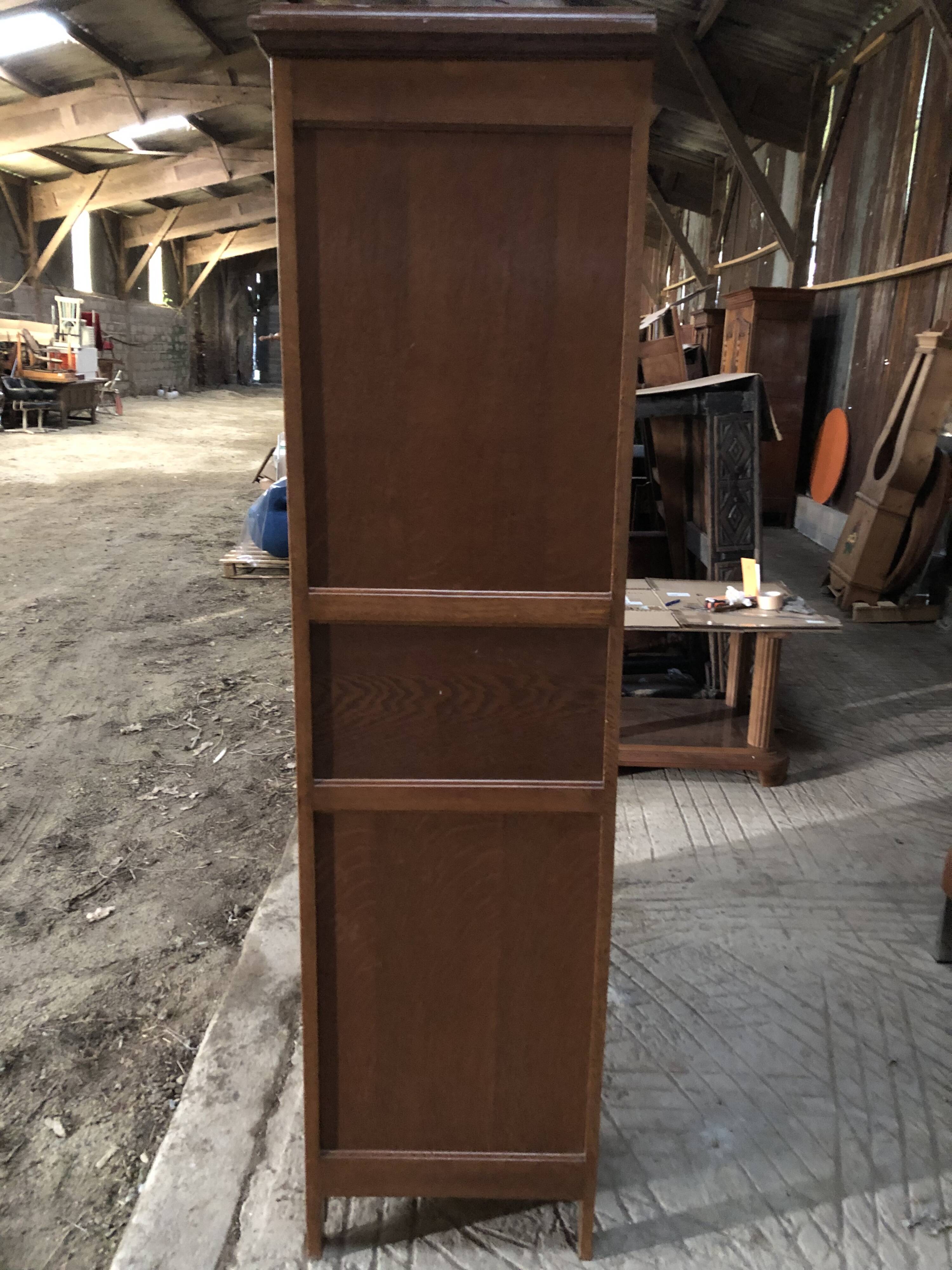 Vintage rococo oak bookcase with 2 glass doors.