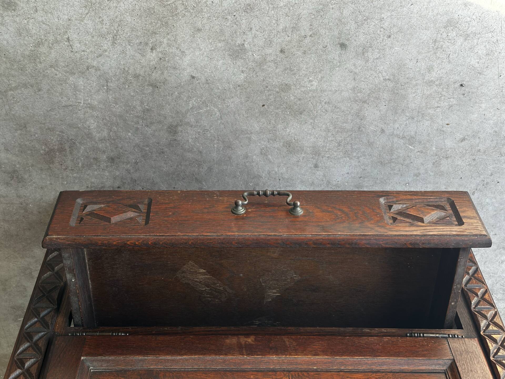 Small storage cabinet in carved oak – circa 1930