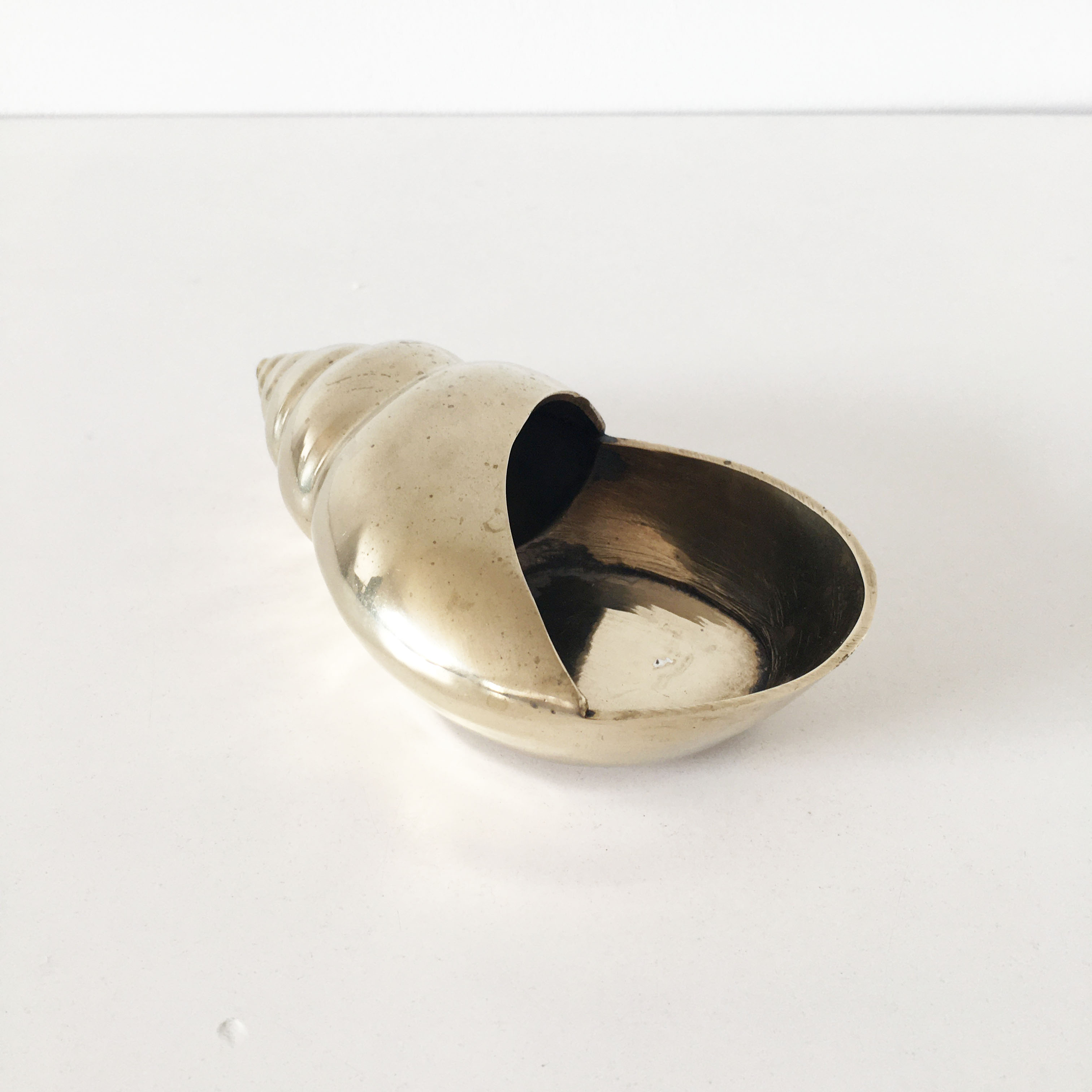 Vintage brass shell ashtray