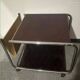 1970s/80s coffee table on casters with metal tubing, light-colored door