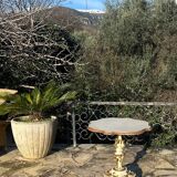 Carved and lacquered wooden side table.