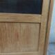 Charming vintage display cabinet from the 1950s in natural wood.