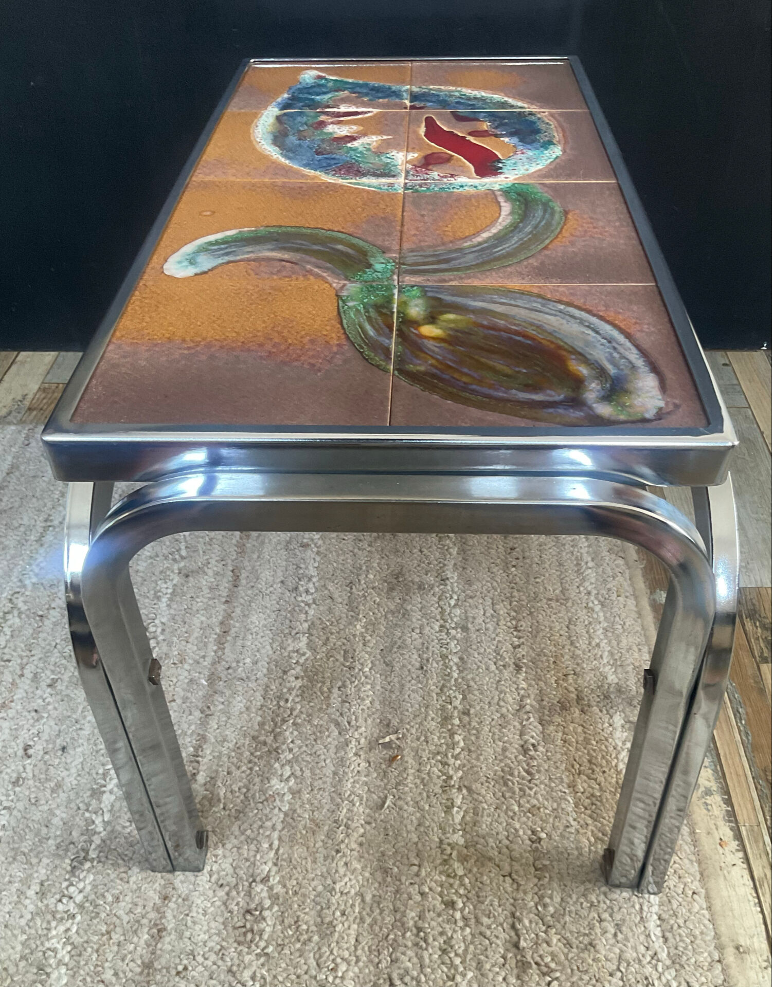 Vintage coffee table in stainless steel and ceramic from the 1970s.