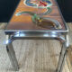 Vintage coffee table in stainless steel and ceramic from the 1970s.
