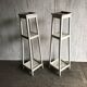 Two white vintage mid-20th century wooden plant stands, 3-tier shelves.