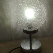 Duo of textured globe lamps with a large play of light.