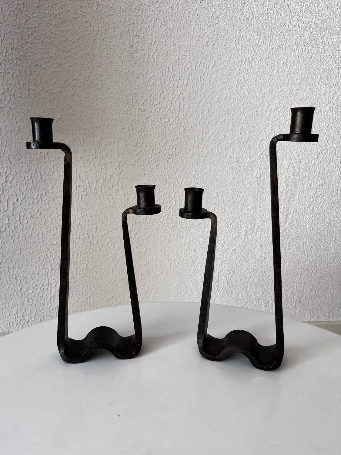 Brutalist wrought iron candlestick pair