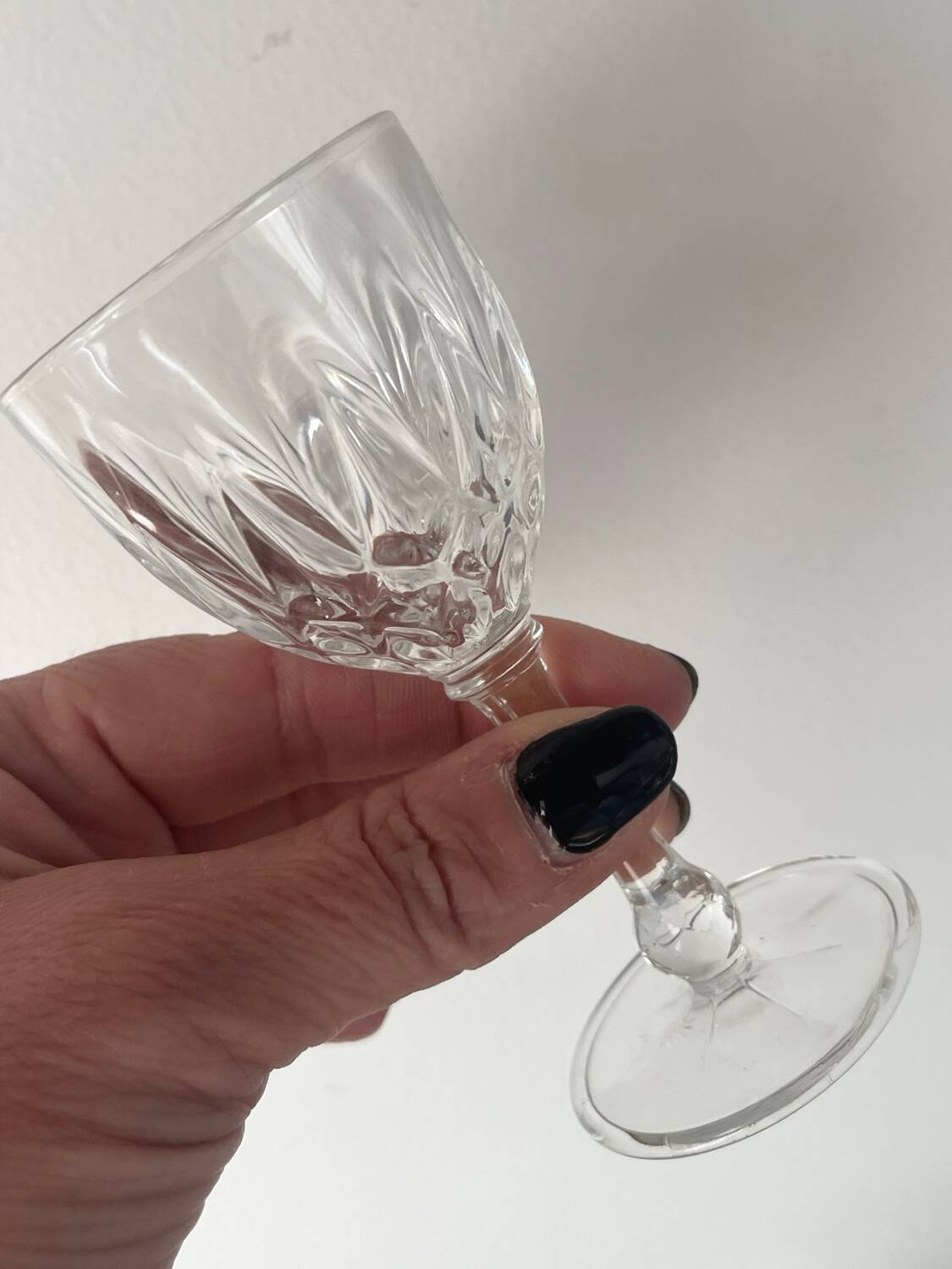 4 cut glass liqueur glasses on stems