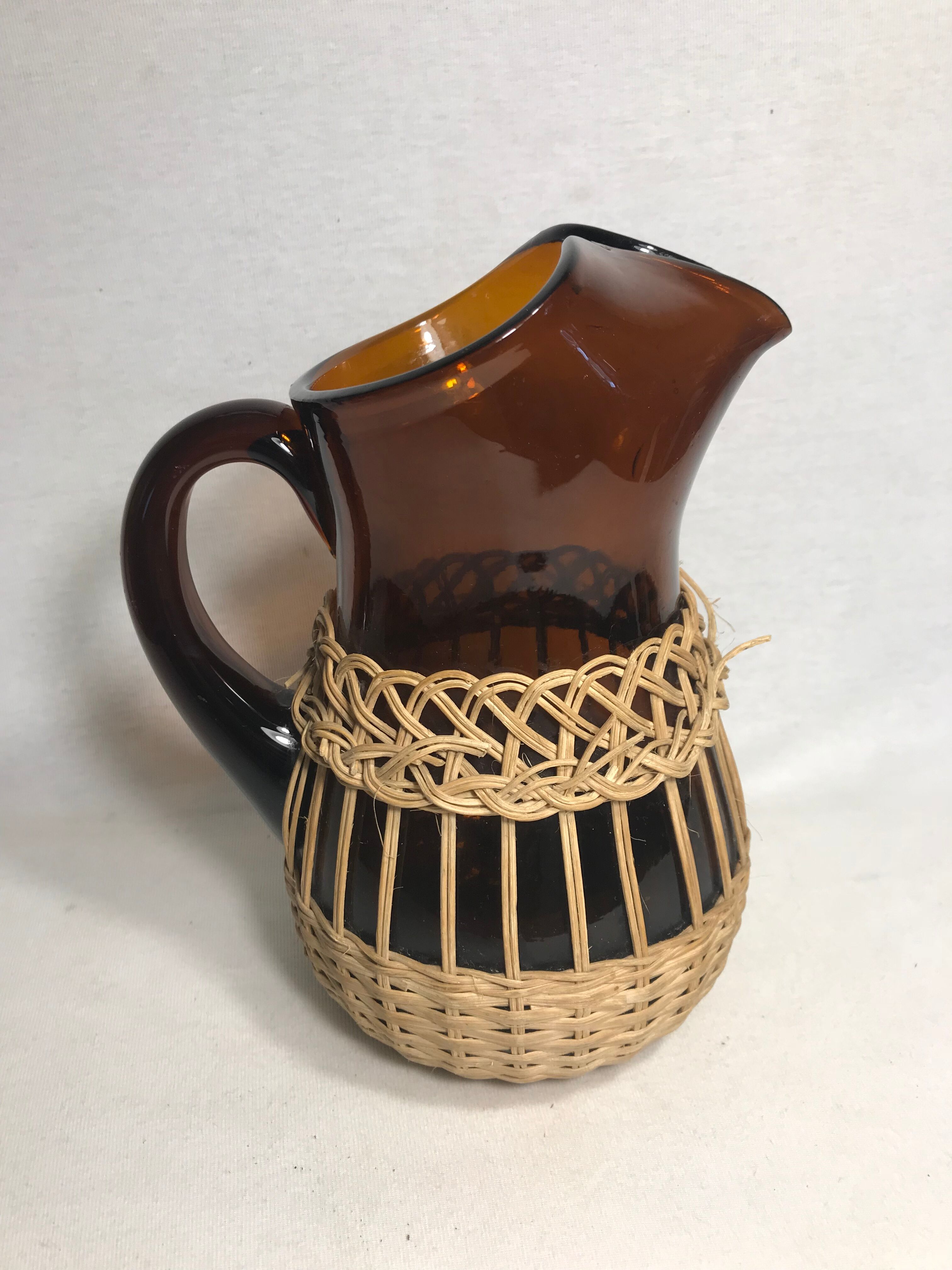 Service old juice carafe and its 9 orange glasses