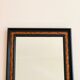 Old wall mirror 72 x 52 cm in black wood and faux mahogany