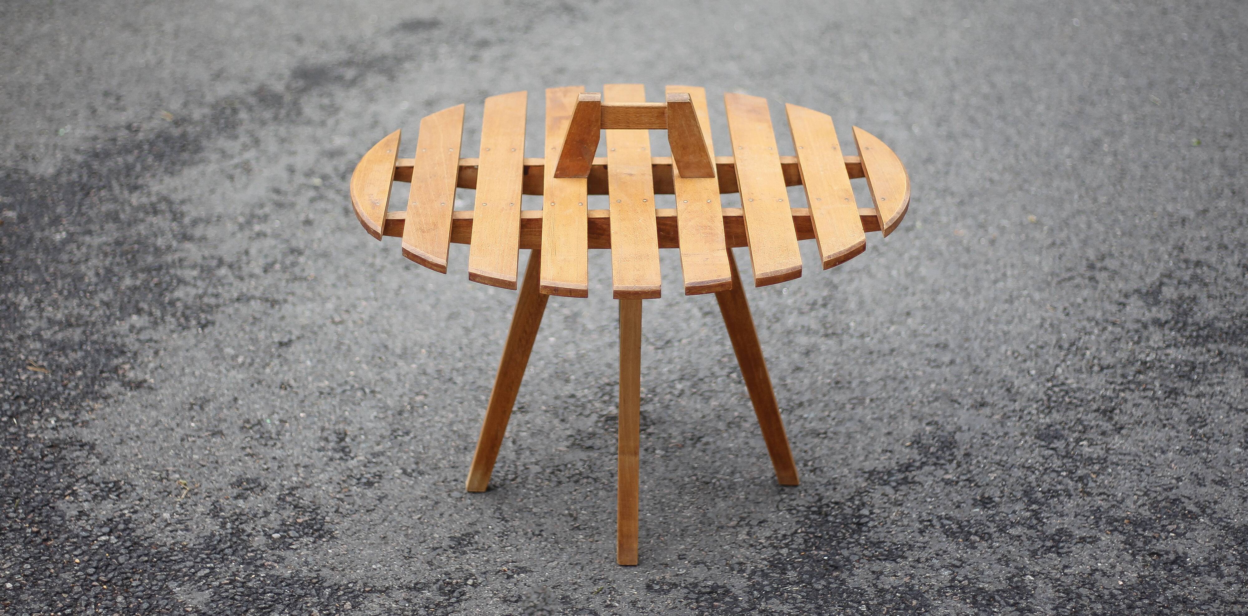 Vintage coffee table, wooden table with central handle, interior decoration, terrace, patio